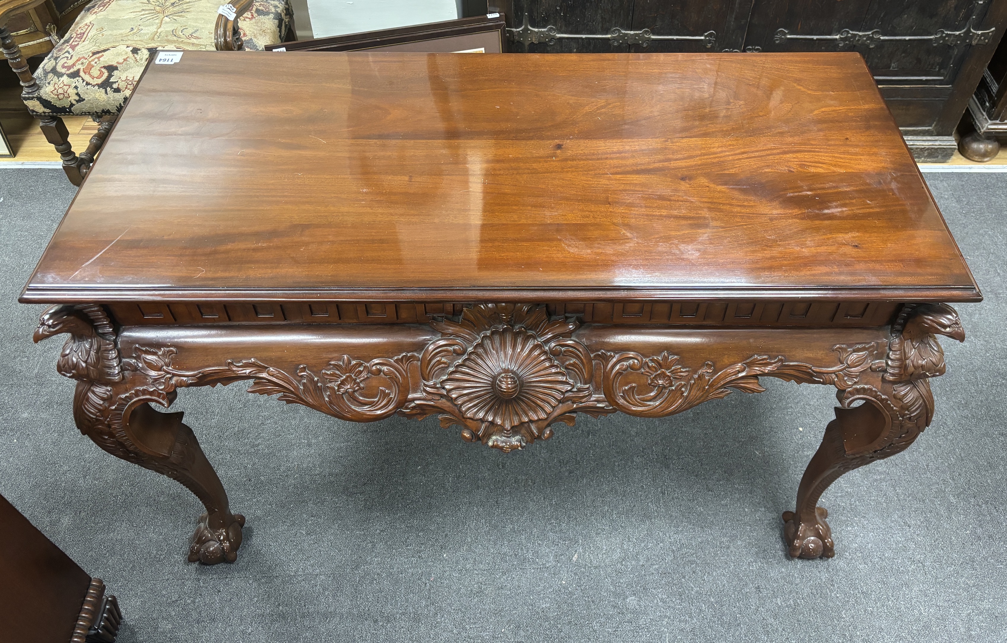 An 18th century style carved mahogany console table, width 136cm, depth 63cm, height 84cm